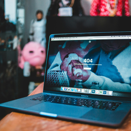 Dev Tech Solutions | an image showing a Macbook pro with a 404 page
