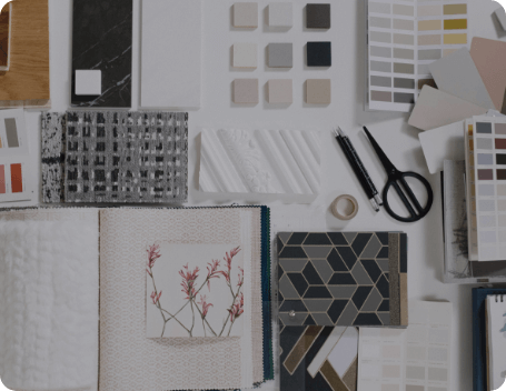 Dev Tech Solutions | Team reviewing a website design presentation on a laptop during a collaborative design discussion.