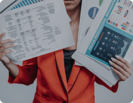 Dev Tech Solutions | Person holding multiple reports and data sheets, representing information overload in digital decision-making.