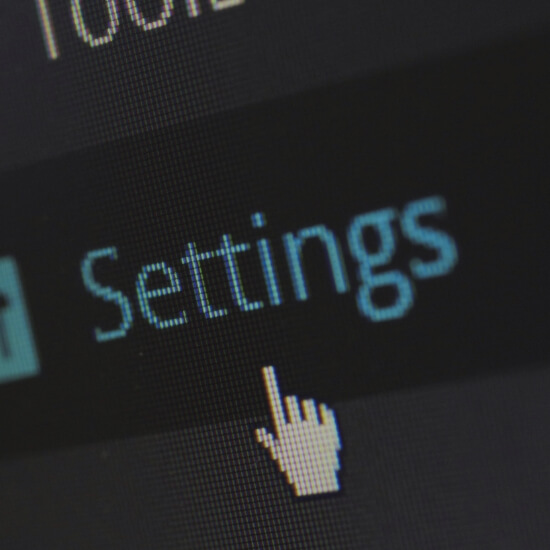 Dev Tech Solutions | Close-up of a computer screen showing a settings menu with a cursor icon.